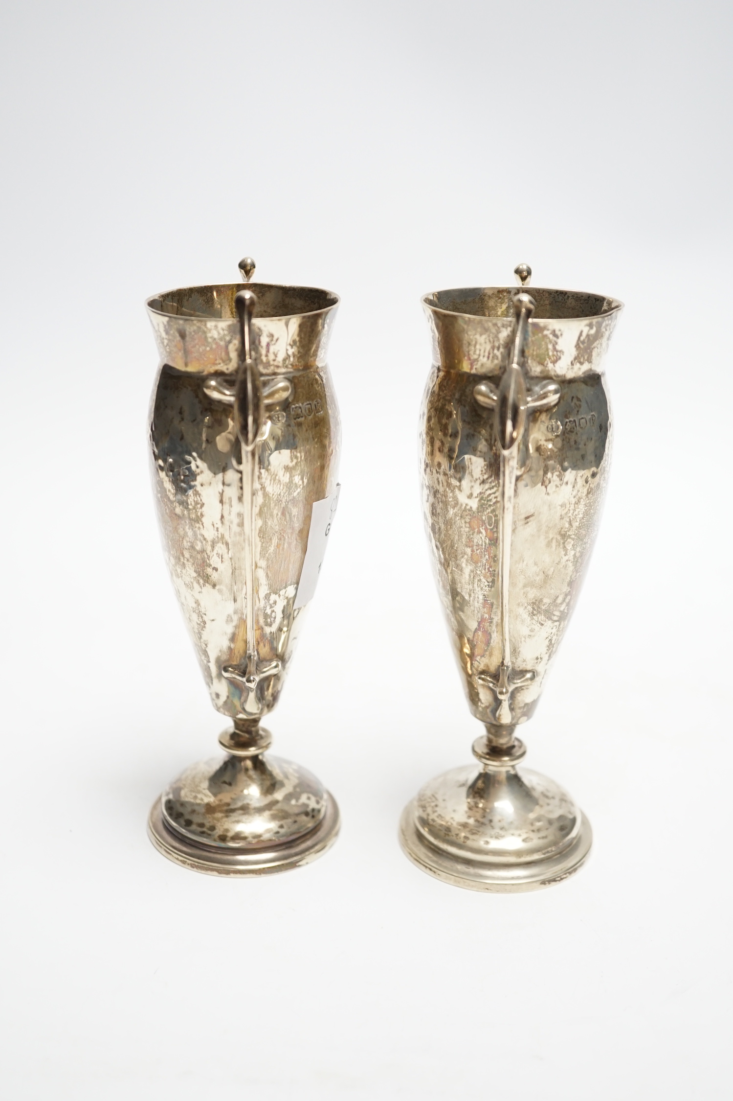 A pair of Edwardian Art Nouveau silver two handled posy vases, Charles Edwards, London, 1905, 16cm, 8oz.